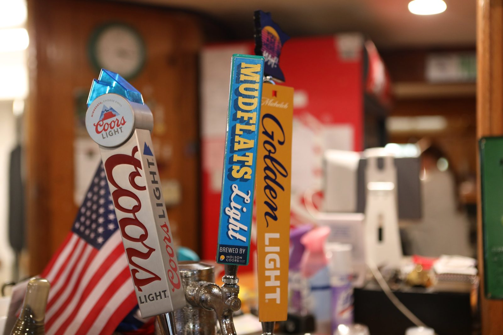 Beer taps behind the Mudflats bar, including the Mudflats Light tap handle